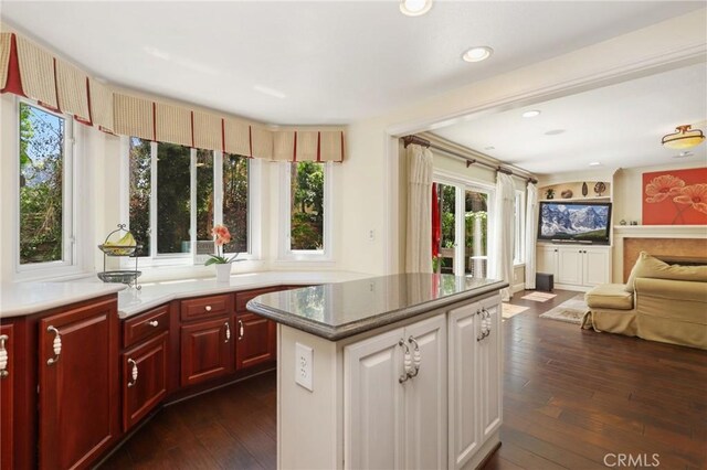 24092 Lapwing Ln, Laguna Niguel, CA 92677 - kitchen with healthy amount of natural light, dark wood-style floors, open floor plan, and recessed lighting