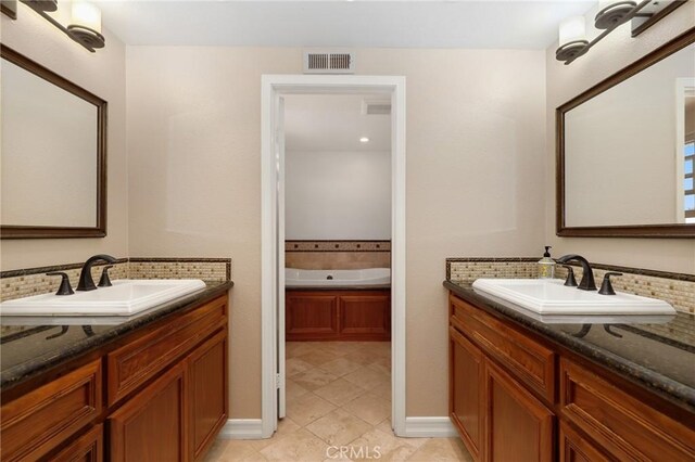 24092 Lapwing Ln, Laguna Niguel, CA 92677 - bathroom featuring two vanities, a garden tub, and tile patterned flooring