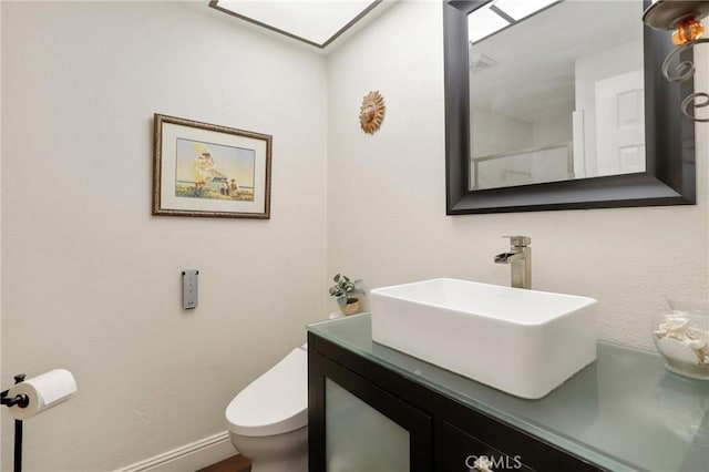 24092 Lapwing Ln, Laguna Niguel, CA 92677 - bathroom featuring toilet, vanity, and baseboards