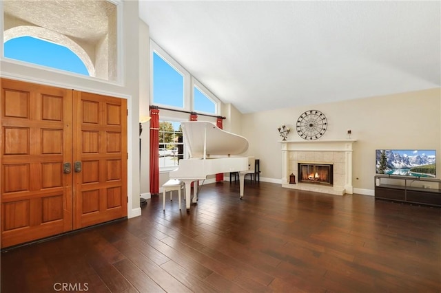 24092 Lapwing Ln, Laguna Niguel, CA 92677 - entrance foyer featuring high vaulted ceiling, a fireplace, wood finished floors, and baseboards