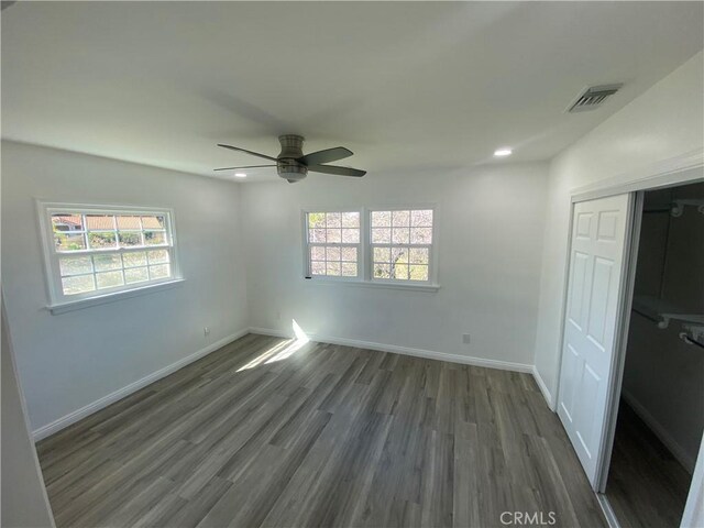 1515 Elizabeth St, Redlands, CA 92373 - unfurnished bedroom with multiple windows, wood finished floors, a closet, baseboards, and recessed lighting