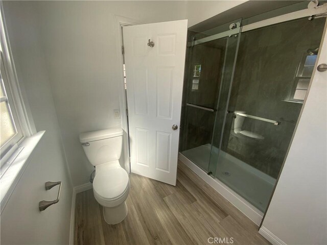 1515 Elizabeth St, Redlands, CA 92373 - bathroom featuring toilet, wood finished floors, and a shower stall