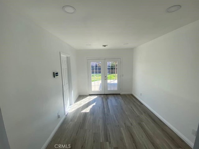 1515 Elizabeth St, Redlands, CA 92373 - spare room with french doors, baseboards, and dark wood-style flooring