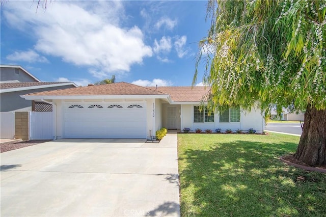17272 Julip Ln, Huntington Beach, CA 92647 - single story home with a garage, driveway, a front yard, and stucco siding