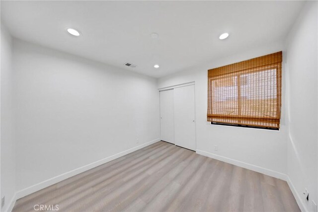 867 Winding Brook Ln, Walnut, CA 91789 - unfurnished bedroom with a closet, recessed lighting, wood finished floors, and baseboards