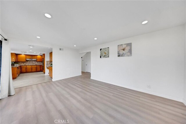 867 Winding Brook Ln, Walnut, CA 91789 - unfurnished living room with recessed lighting, baseboards, and light wood-type flooring