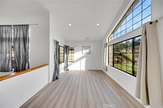 867 Winding Brook Ln, Walnut, CA 91789 - empty room featuring recessed lighting, wood finished floors, baseboards, and high vaulted ceiling