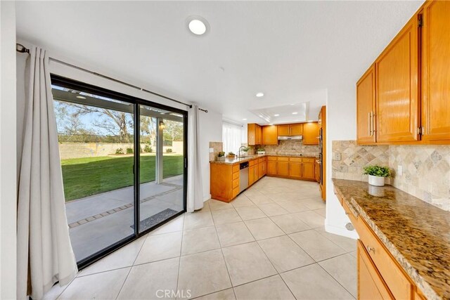 867 Winding Brook Ln, Walnut, CA 91789 - kitchen featuring stainless steel dishwasher, recessed lighting, backsplash, brown cabinets, and light tile patterned floors