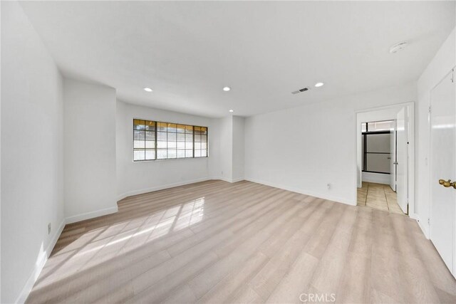 867 Winding Brook Ln, Walnut, CA 91789 - spare room featuring recessed lighting, light wood-style floors, and baseboards