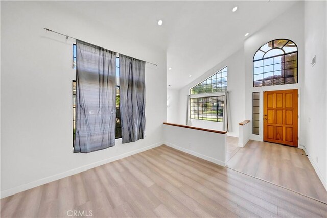 867 Winding Brook Ln, Walnut, CA 91789 - entrance foyer with wood finished floors, high vaulted ceiling, recessed lighting, and baseboards