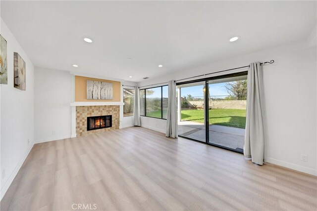 867 Winding Brook Ln, Walnut, CA 91789 - unfurnished living room with recessed lighting, light wood-type flooring, a fireplace, and baseboards