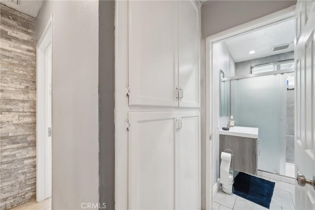 9977 Elwood Ave, Fontana, CA 92335 - bathroom with vanity, tile patterned flooring, and a stall shower