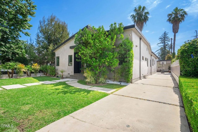 5622 Natick Ave, Sherman Oaks, CA 91411 - view of front of home featuring stucco siding and a front lawn
