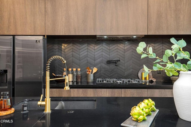 5622 Natick Ave, Sherman Oaks, CA 91411 - kitchen view of stainless steel fridge, a sink, decorative backsplash, pot filler, and modern cabinets