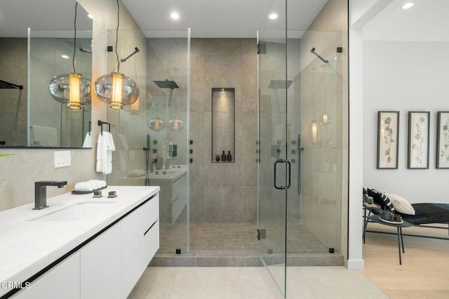 5622 Natick Ave, Sherman Oaks, CA 91411 - bathroom featuring vanity, a shower stall, recessed lighting, and wood finished floors