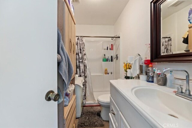 1218 S Sultana Ave Unit A, Ontario, CA 91761 - bathroom featuring vanity, toilet, and a shower with shower curtain