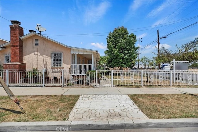 1218 S Sultana Ave Unit A, Ontario, CA 91761 - view of front of home featuring stucco siding and a chimney