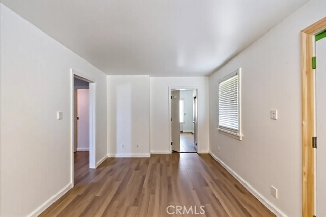 1218 S Sultana Ave Unit A, Ontario, CA 91761 - spare room featuring wood finished floors and baseboards