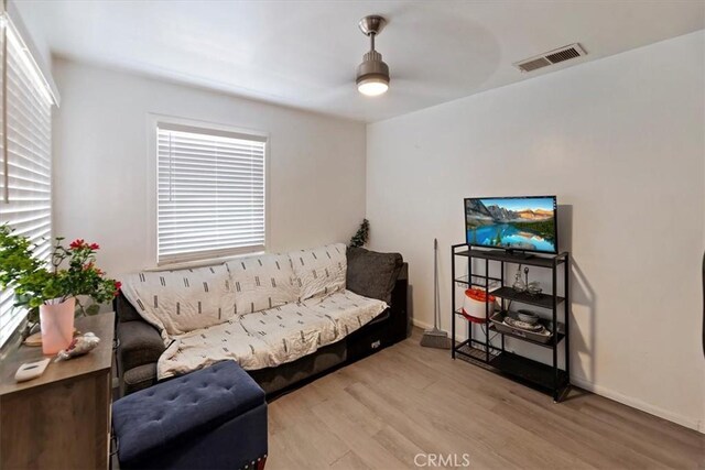 1218 S Sultana Ave Unit A, Ontario, CA 91761 - living room featuring a ceiling fan, wood finished floors, and baseboards