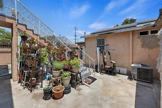 1218 S Sultana Ave Unit A, Ontario, CA 91761 - view of patio with central AC and stairs