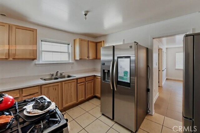1218 S Sultana Ave Unit A, Ontario, CA 91761 - kitchen with stainless steel fridge, a sink, healthy amount of natural light, and freestanding refrigerator