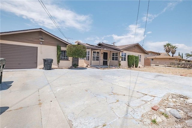 17196 Barbee St, Fontana, CA 92336 - ranch-style home featuring driveway, stucco siding, solar panels, and an attached garage