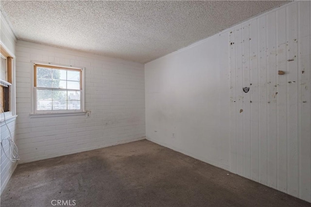 17196 Barbee St, Fontana, CA 92336 - carpeted empty room featuring a textured ceiling and wood walls