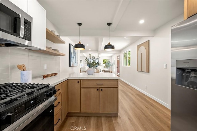 3629 W 144th St, Hawthorne, CA 90250 - kitchen with stainless steel appliances, light wood finished floors, decorative backsplash, light countertops, and recessed lighting