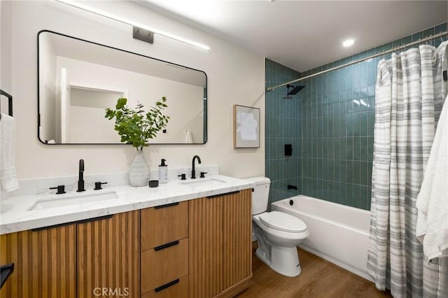 3629 W 144th St, Hawthorne, CA 90250 - bathroom with double vanity, shower / bathtub combination with curtain, toilet, and wood finished floors
