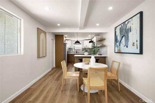 3629 W 144th St, Hawthorne, CA 90250 - dining room with light wood-type flooring, baseboards, beam ceiling, recessed lighting, and healthy amount of natural light