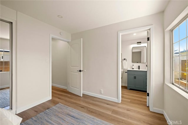 3629 W 144th St, Hawthorne, CA 90250 - unfurnished bedroom with light wood-style floors, baseboards, and ensuite bath