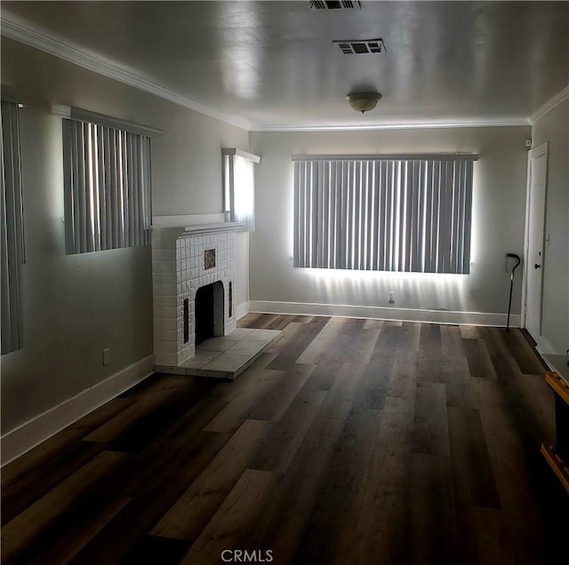 5846 Madden Ave, Los Angeles, CA 90043 - unfurnished living room featuring crown molding, a tiled fireplace, baseboards, and wood finished floors