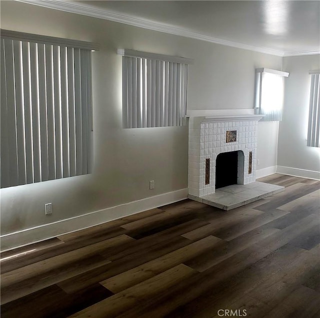 5846 Madden Ave, Los Angeles, CA 90043 - unfurnished living room with crown molding, baseboards, wood finished floors, and a fireplace