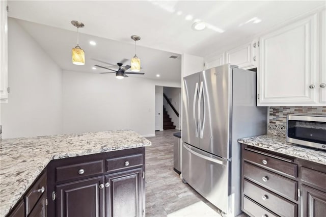 5115 Castelotte Ct, Whittier, CA 90601 - kitchen with appliances with stainless steel finishes, white cabinets, a ceiling fan, dark brown cabinets, and recessed lighting