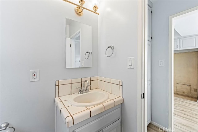 3316 Burritt Way, Glendale, CA 91214 - bathroom featuring backsplash, vanity, and wood finished floors