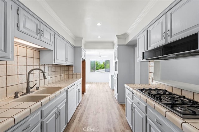 3316 Burritt Way, Glendale, CA 91214 - kitchen with tile counters, gray cabinets, a sink, under cabinet range hood, and light wood-type flooring