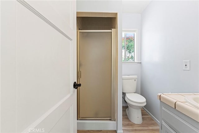 3316 Burritt Way, Glendale, CA 91214 - bathroom featuring vanity, a shower stall, wood finished floors, and toilet