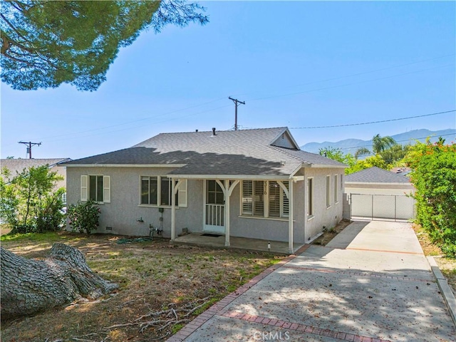 3316 Burritt Way, Glendale, CA 91214 - view of front of home with stucco siding, a garage, roof with shingles, and a mountain view