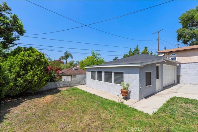 3316 Burritt Way, Glendale, CA 91214 - view of yard featuring an outdoor structure, a garage, and concrete driveway