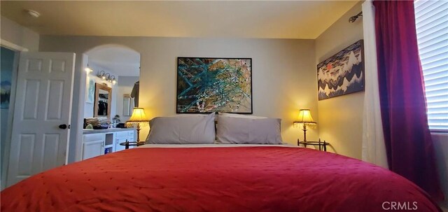 6683 Sherman Hoyt Ave Unit 29, Palms, CA 92277 - bedroom featuring arched walkways