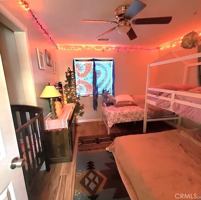 6683 Sherman Hoyt Ave Unit 29, Palms, CA 92277 - bedroom with wood finished floors and baseboards