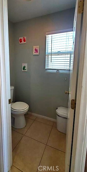 6683 Sherman Hoyt Ave Unit 29, Palms, CA 92277 - bathroom featuring toilet and tile patterned flooring