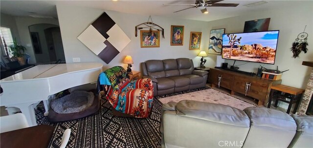 6683 Sherman Hoyt Ave Unit 29, Palms, CA 92277 - living room with a ceiling fan and arched walkways
