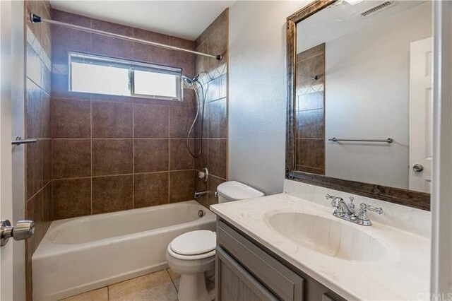 6683 Sherman Hoyt Ave Unit 29, Palms, CA 92277 - full bath featuring toilet, vanity, washtub / shower combination, and tile patterned floors