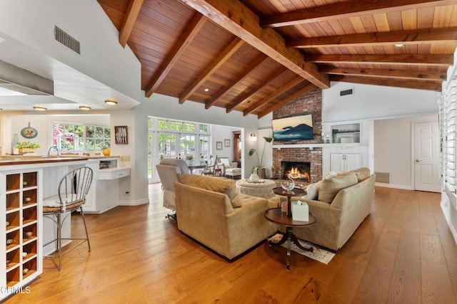 2210 Brambling Ln, Pasadena, CA 91107 - living room with wood ceiling, a fireplace, and light wood finished floors