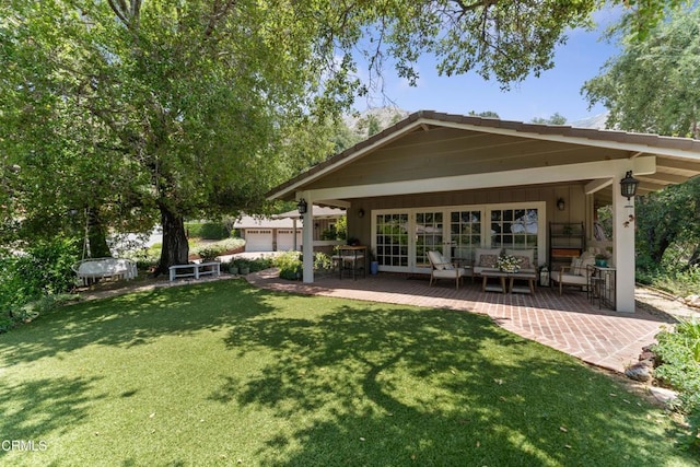 2210 Brambling Ln, Pasadena, CA 91107 - back of property featuring a lawn, an outdoor living space, and a patio