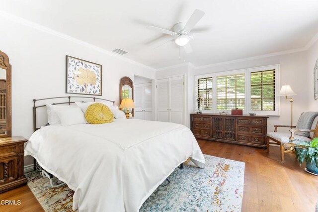 2210 Brambling Ln, Pasadena, CA 91107 - bedroom with ornamental molding, wood finished floors, a ceiling fan, and a closet