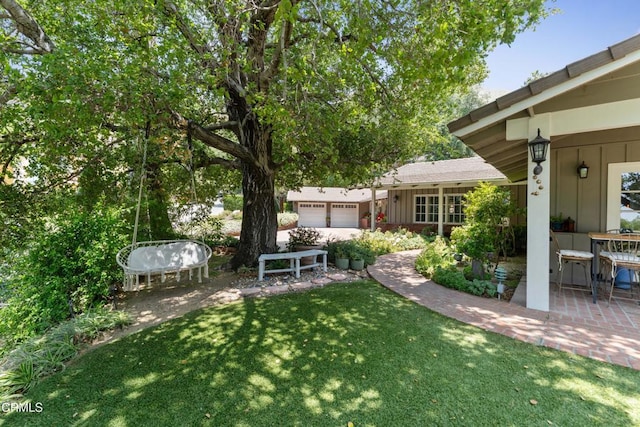 2210 Brambling Ln, Pasadena, CA 91107 - view of green lawn with a garage and a patio