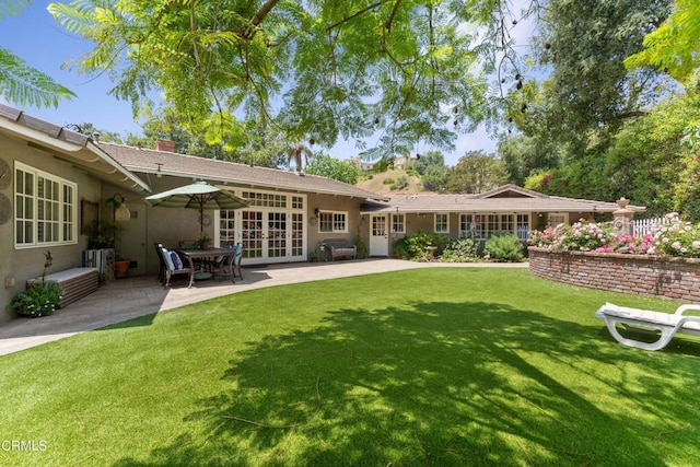 2210 Brambling Ln, Pasadena, CA 91107 - back of property with a patio, french doors, a yard, a chimney, and stucco siding