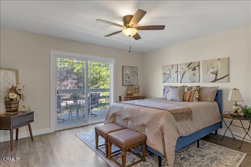 22150 Buena Vista St, Tehachapi, CA 93561 - bedroom with access to exterior, light wood-type flooring, a ceiling fan, and baseboards